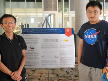 Dr. Hongxu Ding stands with Ziyuan Wang.